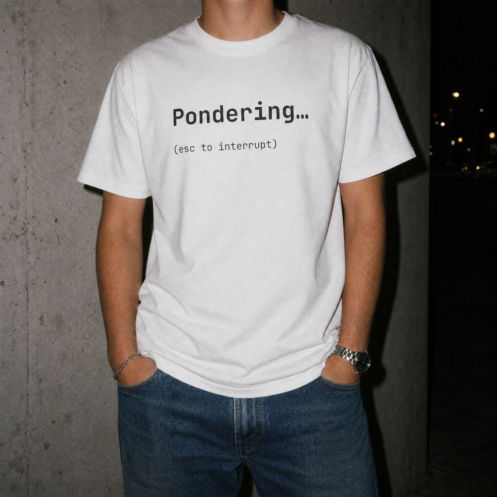 White Pondering esc to interrupt t-shirt worn at night with flash